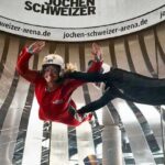 jochen-schweizer-arena.de/onewavestudios und Derk Hoberg -- Verena Bentele beim Bodyflying